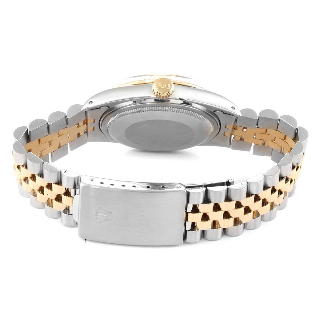 The image shows the back view of a Vintage Collection Rolex watch, highlighting the clasp, bracelet, case back, and crown.