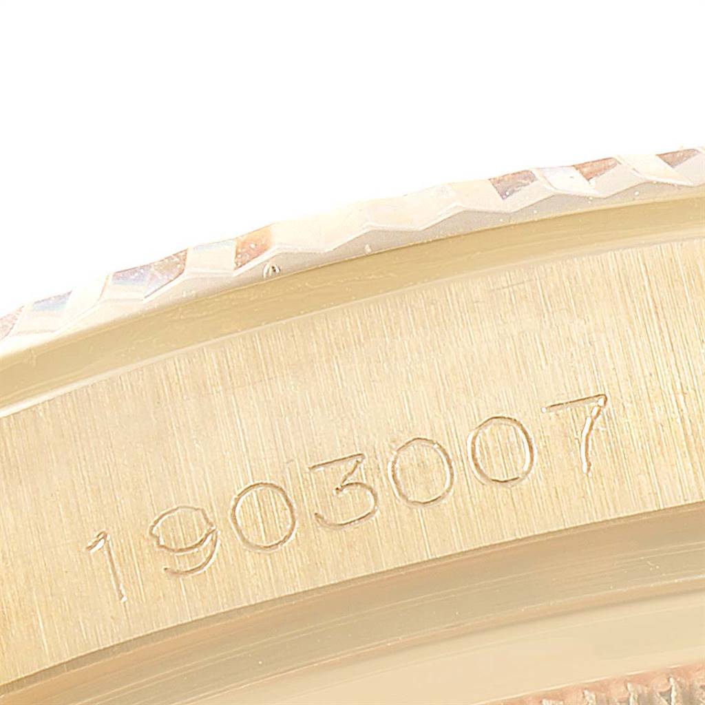 This is a close-up image of the side of a Rolex Vintage Collection 1803 Men's Yellow Gold Champagne Dial 1803 Men's Yellow Gold Champagne Dial model, showing the engraving of the serial number.