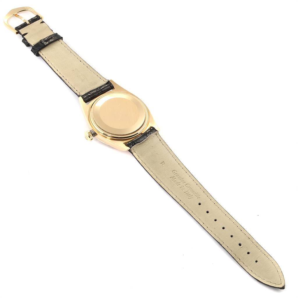 The image shows the back view of a Rolex Vintage Collection 1803 Men's Yellow Gold Champagne Dial 1803 Men's Yellow Gold Champagne Dial watch with the strap laid flat.