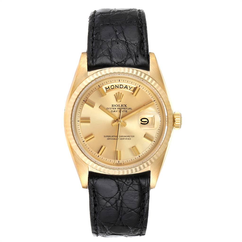 The image shows a front view of a Vintage Collection Rolex watch featuring a gold dial and black leather strap.