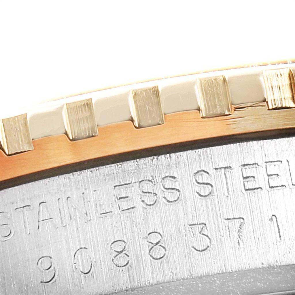 Close-up of the bezel and case of a Rolex Vintage Collection 26251 Men
s Steel and Gold (two tone) Champagne Dial 26251 Men
s Steel and Gold (two tone) Champagne Dial watch, highlighting the stainless steel and gold details.