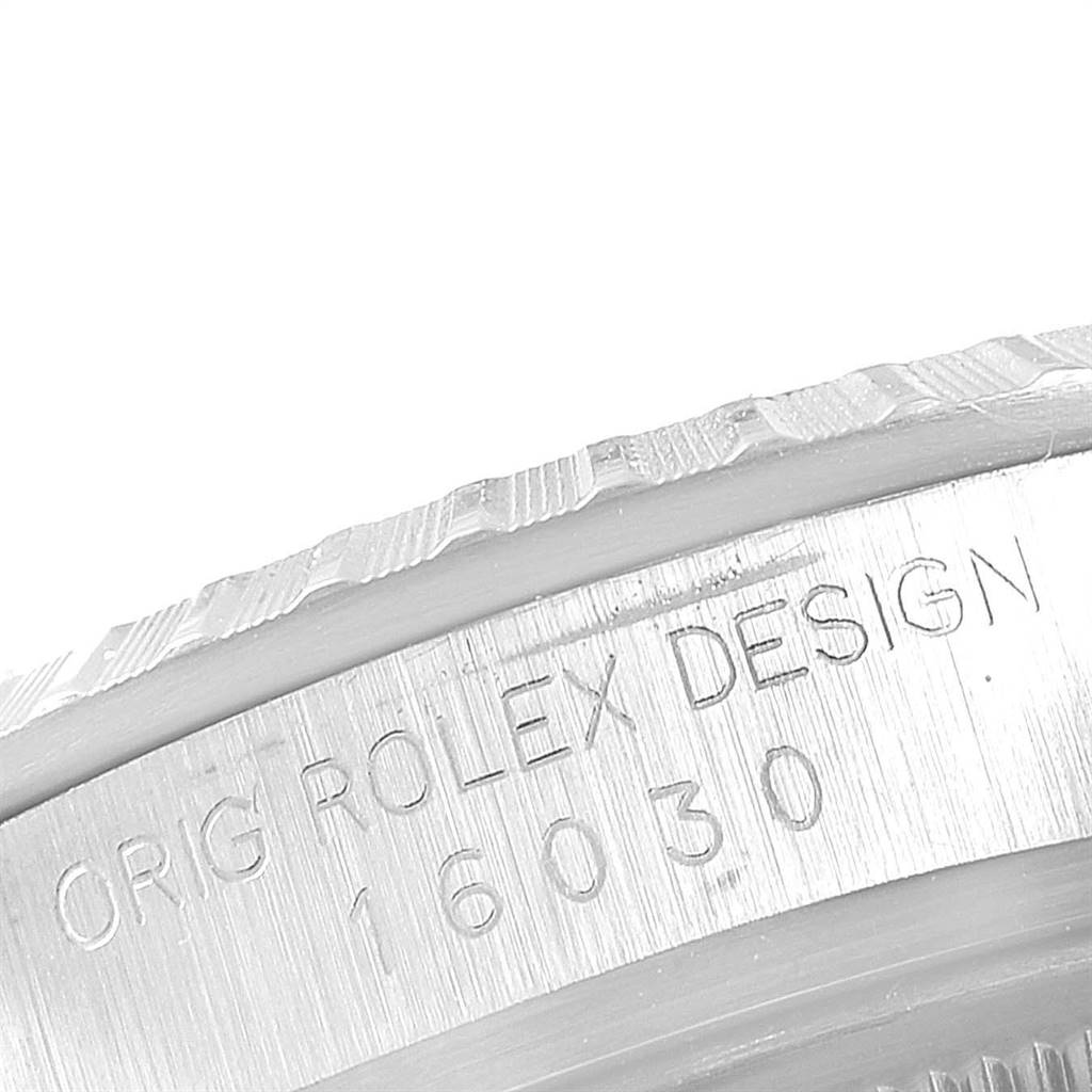This image shows a close-up of the engraved side of a Vintage Collection Rolex watch, featuring "ROLEX DESIGN 16030."