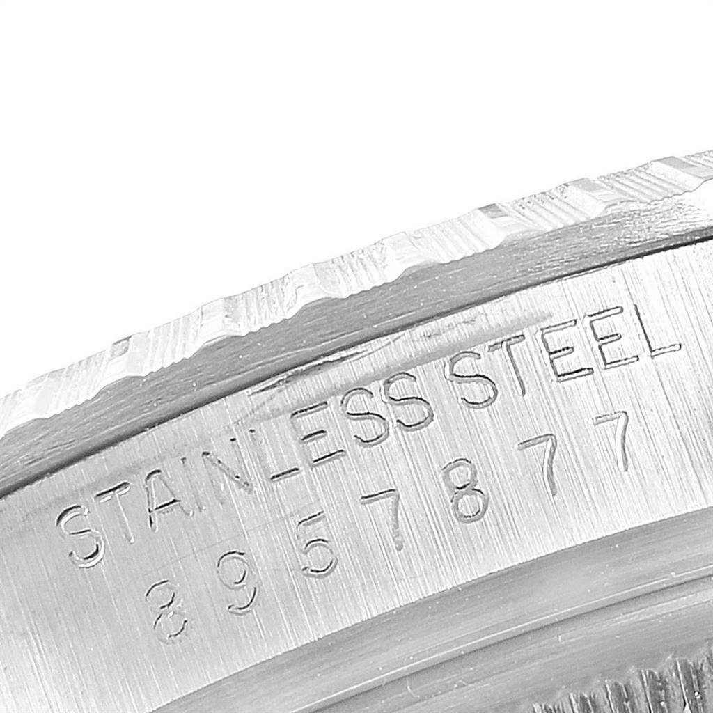 This image shows the stainless steel case back of a Vintage Collection model by Rolex, featuring engraved text and serial numbers.