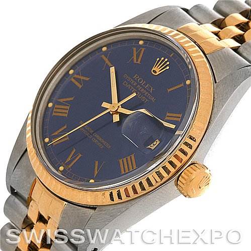 The image shows the face and part of the band of a Rolex Vintage Collection 16013 Men's Stainless Steel Blue Dial 16013 Men's Stainless Steel Blue Dial watch at an angle showcasing the crown and bezel.
