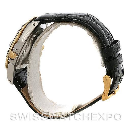 The image shows a side profile of the Vintage Collection model by Rolex, highlighting the bezel, crown, and black leather strap with a gold buckle.