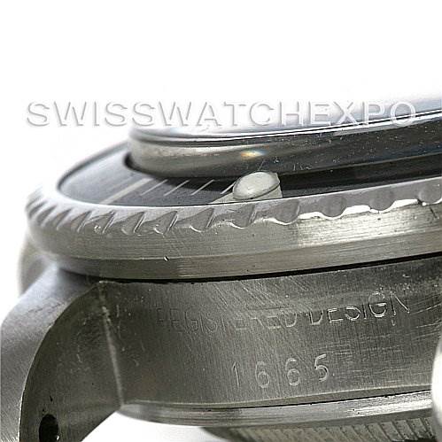 This image shows a close-up angle of the bezel, case, and part of the bracelet attachment of a Rolex Vintage Collection 1665 Men's Stainless Steel  1665 Men's Stainless Steel  model 1665.