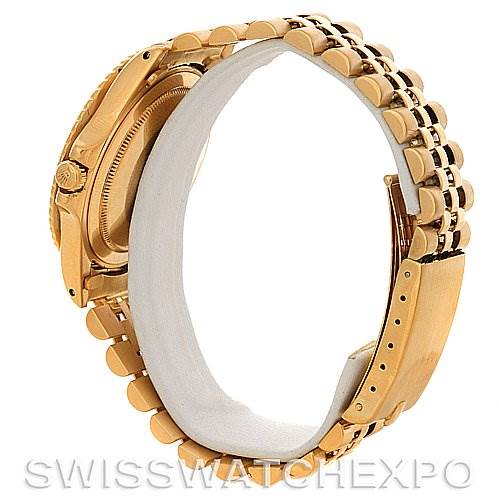 The image shows a side and rear view of the Rolex Vintage Collection 1675 Men's Yellow Gold Brown Dial 1675 Men's Yellow Gold Brown Dial watch, highlighting its gold case, bracelet, and clasp.