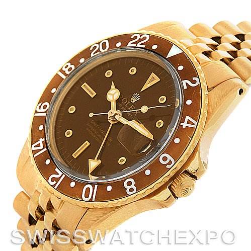 The Rolex Vintage Collection 1675 Men's Yellow Gold Brown Dial 1675 Men's Yellow Gold Brown Dial model is viewed from an angle that highlights the watch face, bezel, and part of the bracelet.