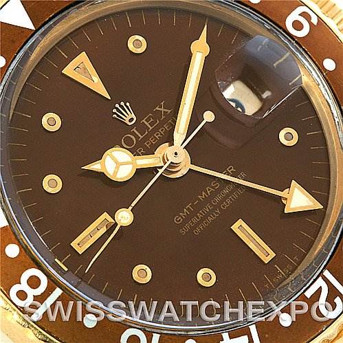 This image shows a close-up, top-down view of the dial of a Rolex GMT-Master Vintage Collection watch.