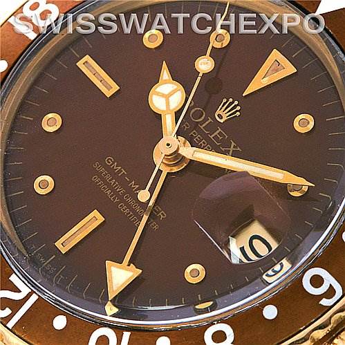 The image shows a close-up of the dial of a Rolex Vintage Collection 1675 Men's Yellow Gold Brown Dial 1675 Men's Yellow Gold Brown Dial GMT-Master watch, displaying the hour markers, hands, and date window.