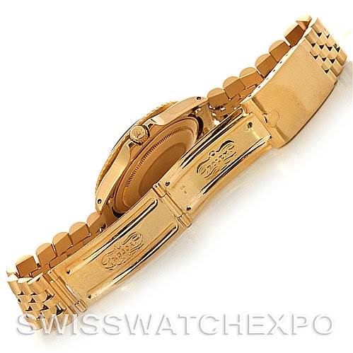 The image shows the backside and clasp of a Rolex Vintage Collection 1675 Men's Yellow Gold Brown Dial 1675 Men's Yellow Gold Brown Dial watch, focusing on its gold bracelet and folding clasp.