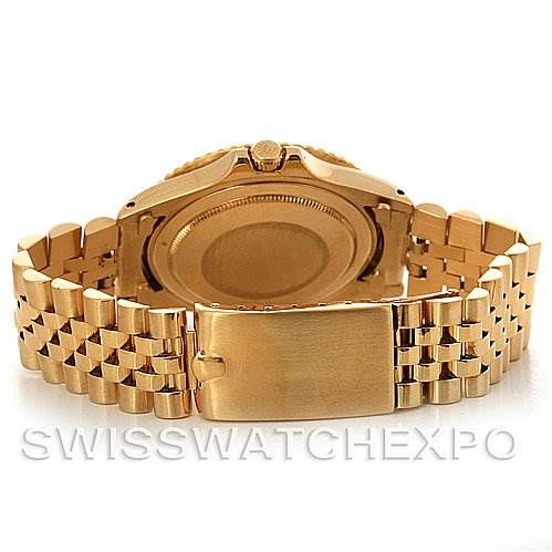 This image shows the back and bracelet of a Rolex Vintage Collection 1675 Men's Yellow Gold Brown Dial 1675 Men's Yellow Gold Brown Dial model watch, featuring a gold finish.