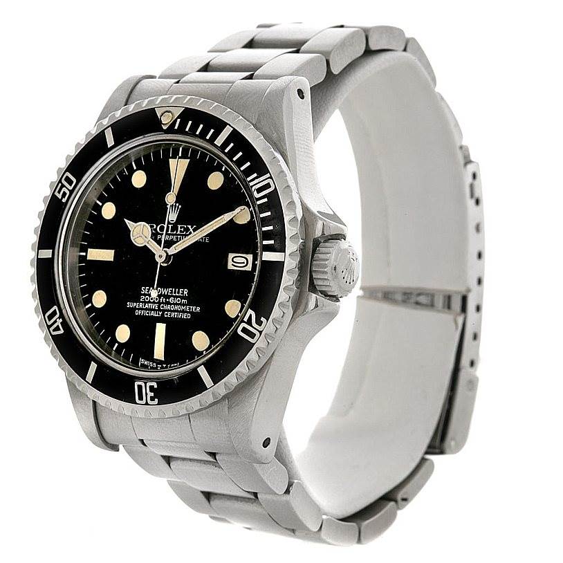 The image shows a side-angle view of the Rolex Vintage Collection 1665 Men's Stainless Steel  1665 Men's Stainless Steel  Sea-Dweller watch, displaying its dial, bezel, and metal bracelet.