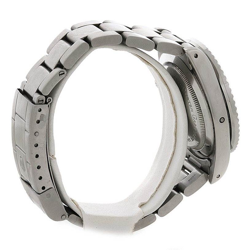 The image shows a side view of the Rolex Vintage Collection 1665 Men's Stainless Steel  1665 Men's Stainless Steel  watch, highlighting its metal bracelet and part of the case back.