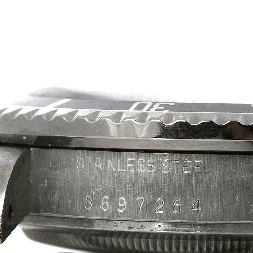 This is a close-up side view of the Rolex Vintage Collection 1665 Men's Stainless Steel  1665 Men's Stainless Steel  model, showcasing the watch case, bezel, and serial number.