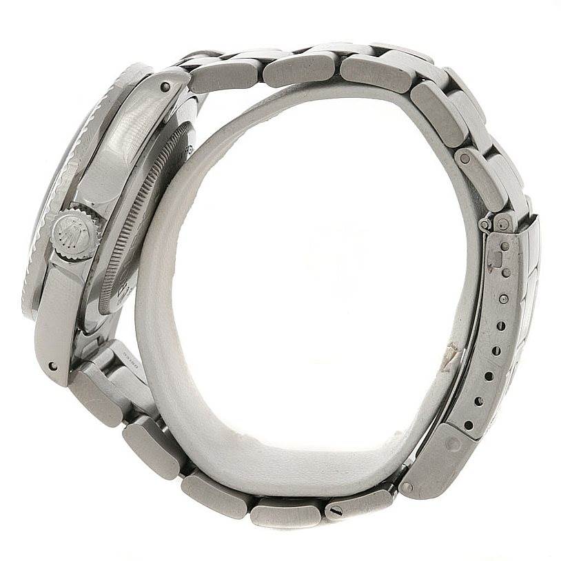 This image shows a side view of a Rolex Vintage Collection 1665 Men's Stainless Steel  1665 Men's Stainless Steel  watch highlighting the crown, case, and bracelet.