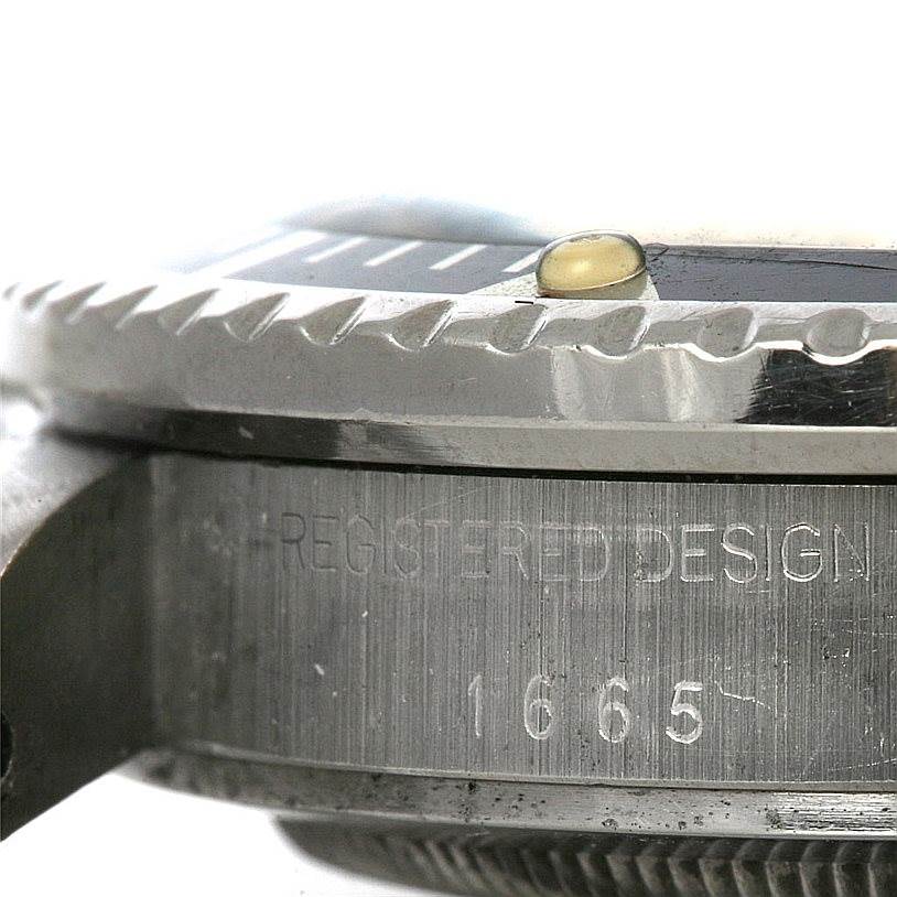 The image shows a close-up side view of the bezel and case of the Rolex Vintage Collection 1665 Men's Stainless Steel  1665 Men's Stainless Steel  model 1665.