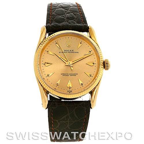 This Rolex Vintage Collection 1011 Men's Yellow Gold Champagne Dial 1011 Men's Yellow Gold Champagne Dial watch is shown from the front, displaying its dial, crown, and leather strap.