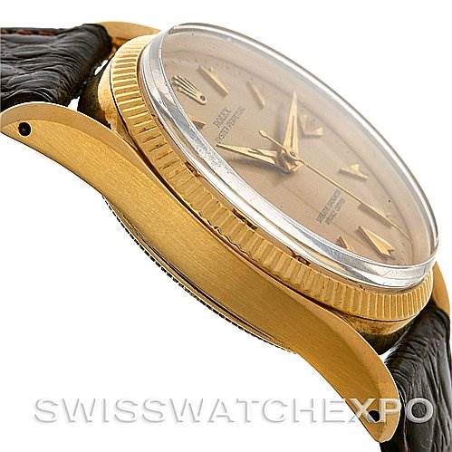 Side angle view of a Vintage Collection Rolex watch, showing the case, bezel, dial, and part of the strap.