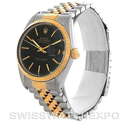 The image shows a side view of the Rolex Vintage Collection 16013 Men
s Stainless Steel Black Dial 16013 Men
s Stainless Steel Black Dial Datejust model, highlighting the black dial, gold bezel, and two-tone bracelet.