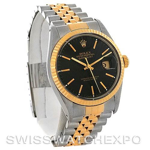 The image shows the front angle of the Rolex Vintage Collection 16013 Men
s Stainless Steel Black Dial 16013 Men
s Stainless Steel Black Dial watch, highlighting its black dial, two-tone bracelet, and fluted bezel.