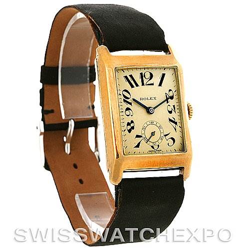 This image shows a Vintage Collection Rolex watch from a front-left angle, highlighting its rectangular face and black leather strap.