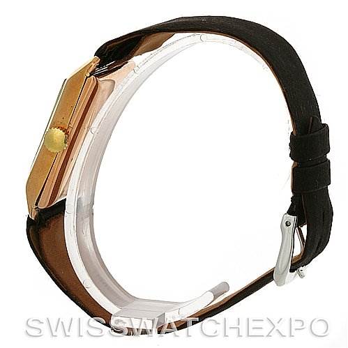 The image shows a side view of the Rolex Vintage Collection Men's Yellow Gold Beige Dial Men's Yellow Gold Beige Dial watch, highlighting the crown, case, and leather strap.