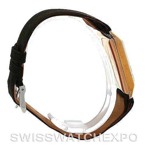 This image shows a side view of a Rolex Vintage Collection Men's Yellow Gold Beige Dial Men's Yellow Gold Beige Dial watch, highlighting its case, strap, and buckle.