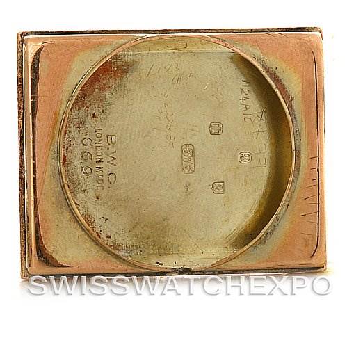The image shows the back cover removed from a Vintage Collection Rolex watch, displaying internal markings and serial numbers.