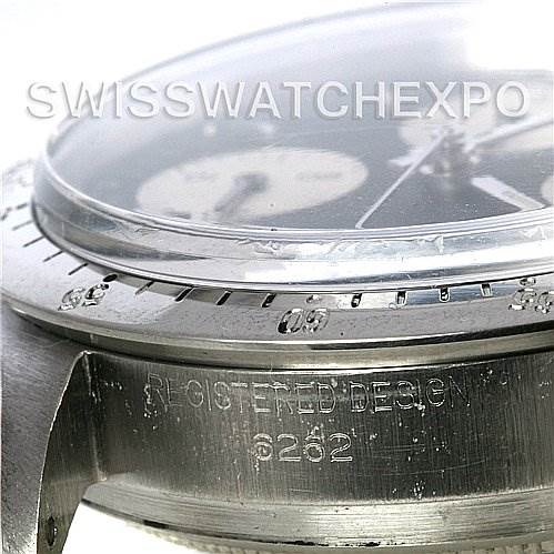 The image shows a close-up, side angle of a Rolex Vintage Collection 6262 Men's Stainless Steel Black Dial 6262 Men's Stainless Steel Black Dial watch, highlighting its bezel and "Registered Design" engraving.