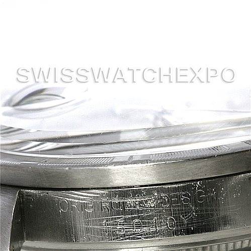 The image shows a close-up of the case details and engraving on a Vintage Collection Rolex watch.