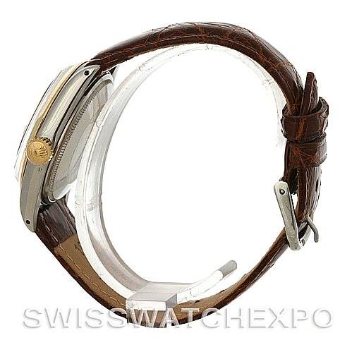 The image shows a side view of the Rolex Vintage Collection 1500 Men's Steel and Gold (two tone) Silver Dial 1500 Men's Steel and Gold (two tone) Silver Dial watch, highlighting its case, crown, and brown leather strap with a buckle.