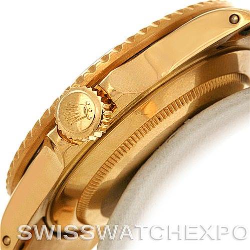 This image shows a close-up side view of the crown and bezel of a Rolex Vintage Collection 16808 Men's Yellow Gold Black Dial 16808 Men's Yellow Gold Black Dial watch in gold.