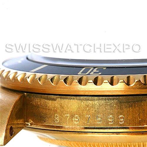 This image shows a close-up side view of the bezel, case, and serial number of the Vintage Collection Rolex watch.