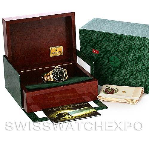 This image shows a Rolex Vintage Collection 16808 Men's Yellow Gold Black Dial 16808 Men's Yellow Gold Black Dial watch inside an open wooden box, with a green outer box, a booklet, and accessories beside it.