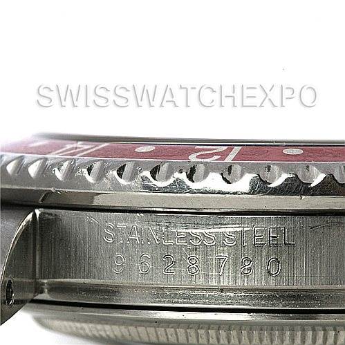 This image shows a close-up of the side view of a Vintage Collection Rolex watch, focusing on the bezel, case, and serial number.