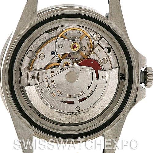 The image shows the open case back of a Vintage Collection Rolex watch, revealing its intricate mechanical movement.