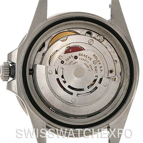 The image shows the internal mechanism and movement of a Vintage Collection model Rolex watch from a rear angle with the case back removed.
