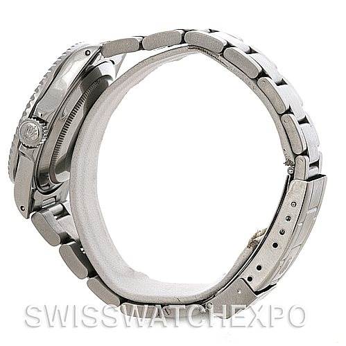 This side view of the Rolex Vintage Collection 168000 Men's Stainless Steel Black Dial 168000 Men's Stainless Steel Black Dial watch shows the crown, case, and metal bracelet.