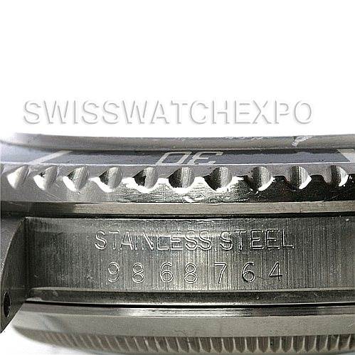 The image shows a close-up of the side of a Rolex Vintage Collection 168000 Men's Stainless Steel Black Dial 168000 Men's Stainless Steel Black Dial watch, focusing on the serial number and stainless steel engraving.