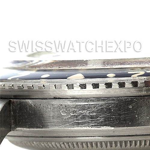 This image shows a close-up side view of the bezel, crystal, and case, including the serial number, of a Rolex Vintage Collection 6542 Men's Stainless Steel Black Dial 6542 Men's Stainless Steel Black Dial watch.