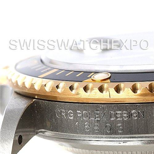 The image shows a close-up of the side and bezel of a Rolex Vintage Collection 16803 Men's Steel and Gold (two tone) Black Dial 16803 Men's Steel and Gold (two tone) Black Dial watch, highlighting the "ORIG ROLEX DESIGN 16803" engraving.