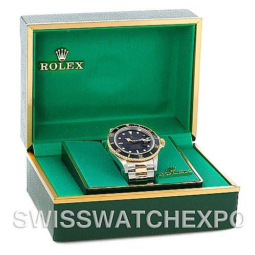 The image shows a Rolex Vintage Collection 16803 Men's Steel and Gold (two tone) Black Dial 16803 Men's Steel and Gold (two tone) Black Dial watch in its open green and gold box, viewed from a front angle.