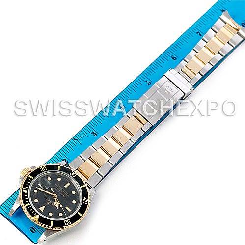 The image shows a Rolex Vintage Collection 16803 Men's Steel and Gold (two tone) Black Dial 16803 Men's Steel and Gold (two tone) Black Dial watch laid flat next to a ruler, displaying the full bracelet and the watch face.