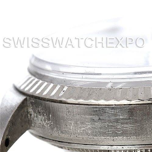 This image shows a close-up side view of the bezel and case of the Rolex Vintage Collection 1601 Men's Stainless Steel Grey Dial 1601 Men's Stainless Steel Grey Dial watch, with part of the serial number visible.
