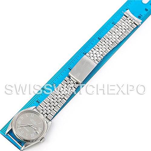 The image shows a top-down view of a Vintage Collection Rolex watch alongside a blue measuring ruler.