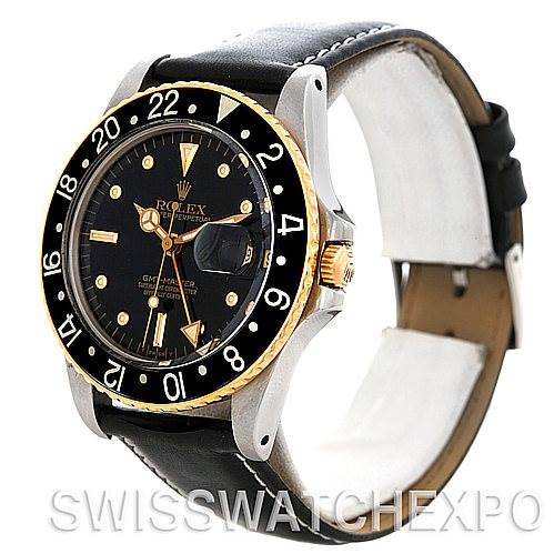 This image shows a Vintage Collection Rolex watch at a slight angle, highlighting the black dial, gold bezel, and leather strap.