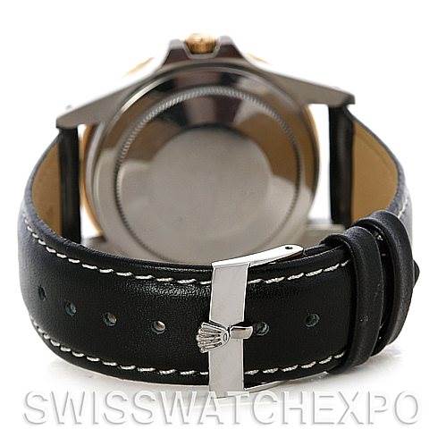 The image shows the back view of a Rolex Vintage Collection 16753 Men's Stainless Steel Black Dial 16753 Men's Stainless Steel Black Dial watch with its leather strap and clasp visible.