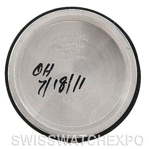 This image shows the inner case back of a Rolex Vintage Collection 6694 Men's Stainless Steel Black Dial 6694 Men's Stainless Steel Black Dial model, engraved with manufacturing details and a handwritten date.