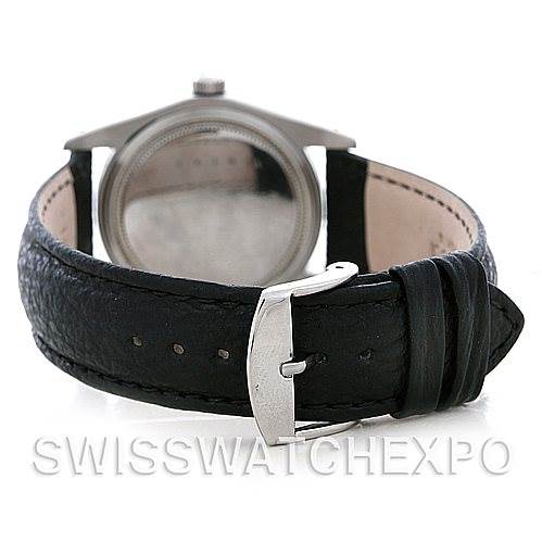 The image shows the back view of a Vintage Collection Rolex watch, highlighting its leather strap and clasp.